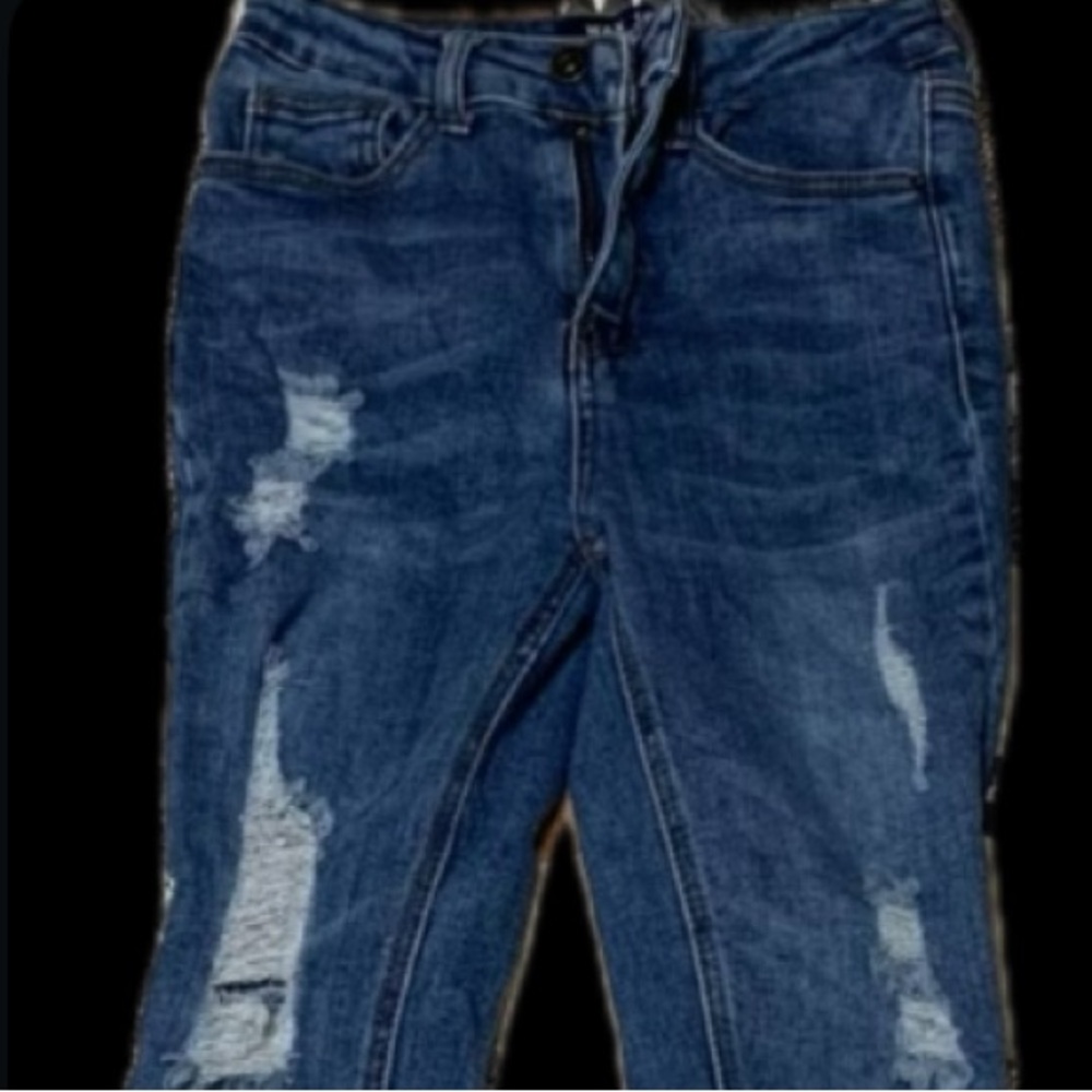 Wax distressed skinny jeans